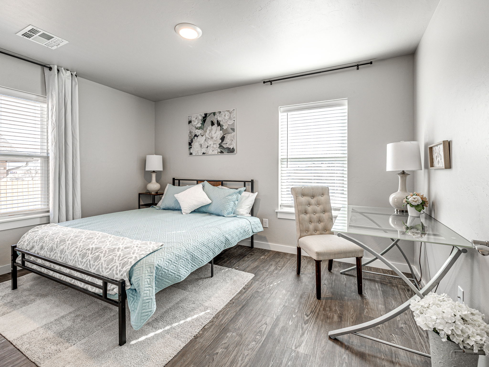 Staged bedroom with a workspace